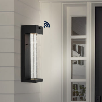 Miranda 5.13" Modern Industrial Iron/Glass Seeded Glass with Dusk-to-Dawn Sensor Integrated LED Outdoor Sconce - JONATHAN Y